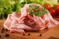 Sliced Ã¢â¬â¹Ã¢â¬â¹mortadella on wooden chopping board